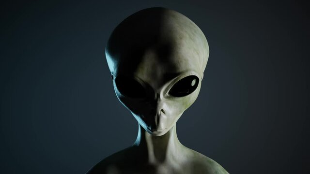 Spooky alien's face on black background. UFO and extraterrestrial life concept.
