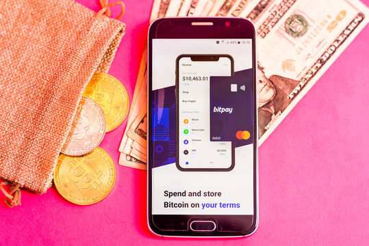 Valencia, Spain - March 2, 2021: Mobile phone with Bitpay app, to buy paying with bitcoins.