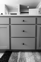 modern kitchen cabinet with round knobs, black and white