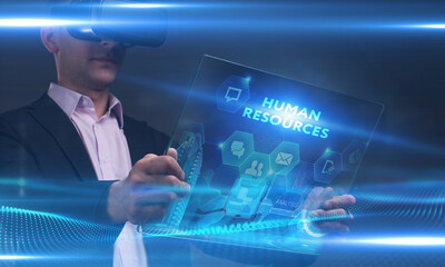 Business, Technology, Internet and network concept. Young businessman working on a virtual screen of the future and sees the inscription: Human resources