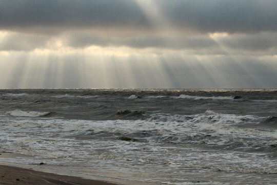 Rays of the sun breaking through the clouds over the Baltic Sea