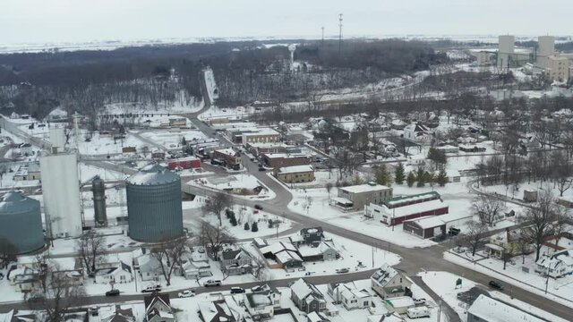 Industrial side of small town during cold winter season in aerial view