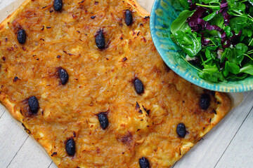 A French pissaladiere tart with onions and black olives