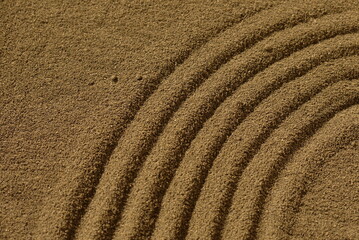 Fototapeta na wymiar Draw a circle-shaped line on the sand beach