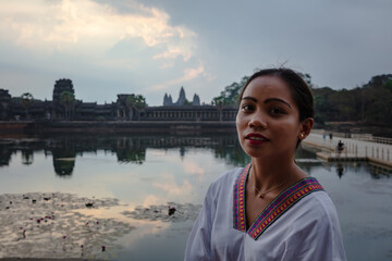 Portrait of beautiful asian woman in front of Angkor Wat, Cambodia