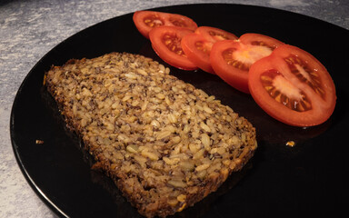 Wholemeal bread and freshly sliced tomatoes - food photography