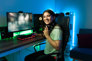 Caucasian woman smiling while playing a videogame