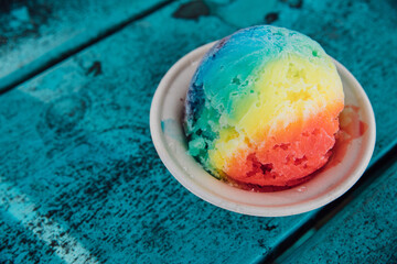 shave ice rainbow colors girl holding