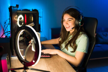 Happy gamer ready to start playing in her gaming computer