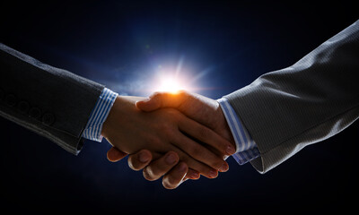 Partnership concept. Image of handshake