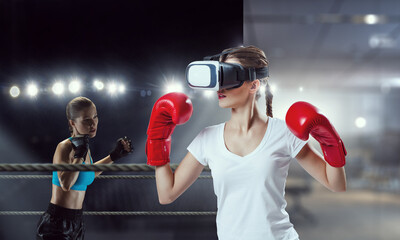 Young woman boxing in VR glasses