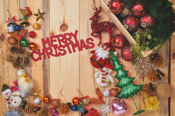 Christmas decorations and ornament on wooden background.