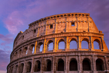 Fototapeta na wymiar Famous Coliseum (Colosseum) of Rome at early sunset.