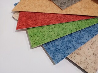 Linoleum. Multi-colored samples of fanned floor coverings.