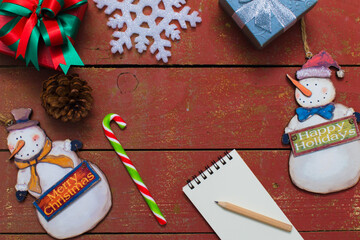 Christmas background with decorations on wooden background.