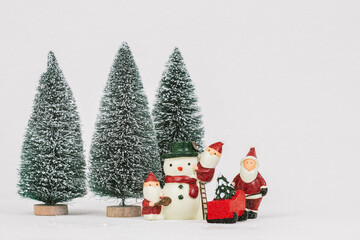 Many Santa Claus prepare decoration for Cristmas holiday festival.