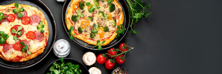 Delicious fresh pizzas variety with different souces and vegetables. Homemade food concept.
