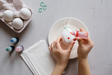 DIY and kids creativity. Step by step instruction: how to make painted easter eggs. Top view, flat lay. Step 4