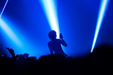 Girl, Close up of recording video with smartphone during a concert.