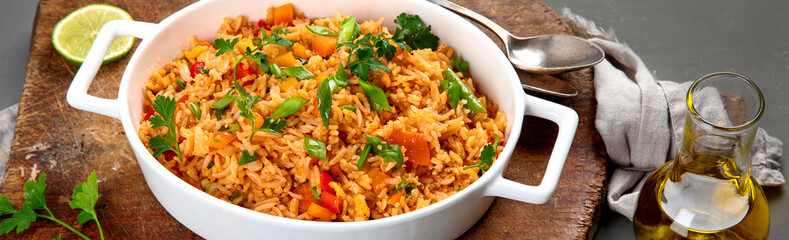 Vegan fried rice with pepper, carrot and green beans and greens
