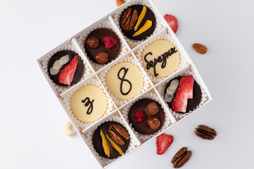 Handmade chocolate with the inscription from March 8. Festive greeting set for a gift.