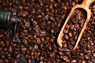 Fresh brown roasted coffee beans as a background