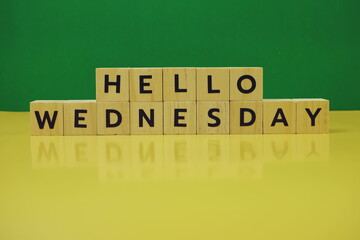 Hello Wednesday alphabet letter on green and yellow background
