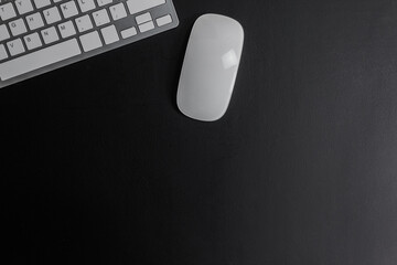 white keyboard and mouse on dark dark background