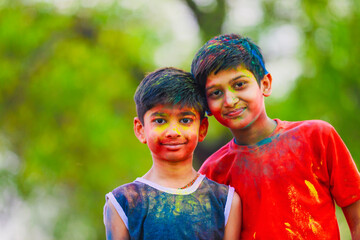 Cute indian little child playing holi. Holi is colors festival in india