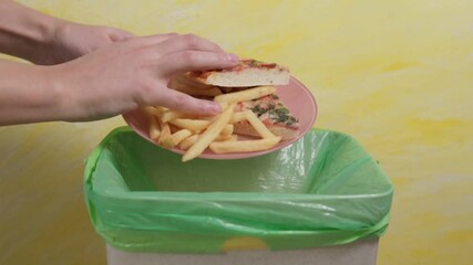 throws junk food fast food pizza in the trash. Slow motion