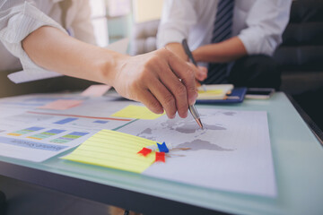Businessman using hand gesture while explain business plan and discussion in the meeting. Selected focus.