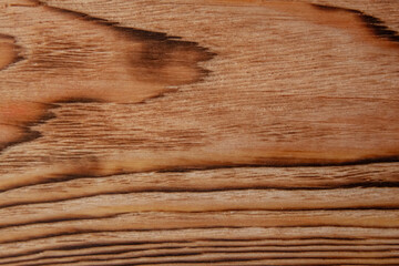 The texture of the pine board after firing and brushing