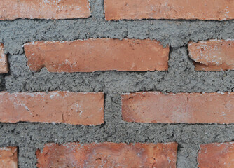 Red brick and concrete layer on the background