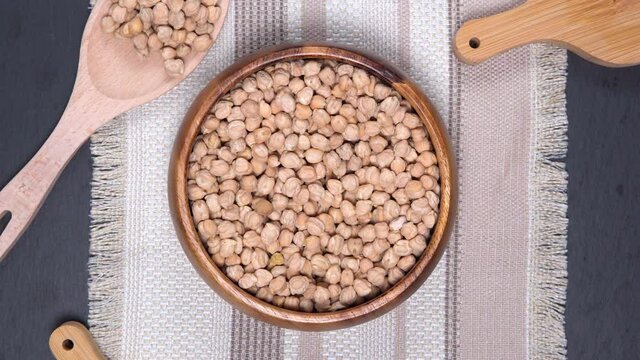 Uncooked dried chickpeas on table. Heap of legume chickpea