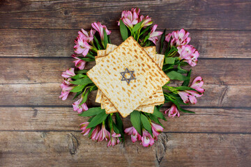 Passover background with matzah and flowers.