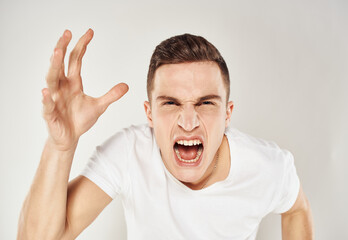 Aggressive man gestures with his hands nervousness madness model
