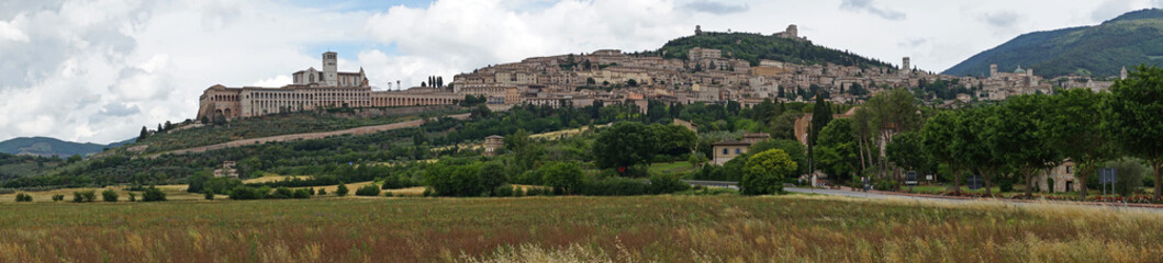 Fototapeta na wymiar Assisi historic old town with Basilica of St. Francis on the hill panoramic view, birthplace of St. Francis, Assisi, Umbria, Italy