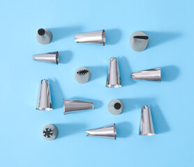Different piping tips on color background