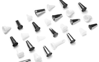 Different piping tips on white background, closeup