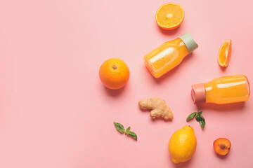 Healthy products and bottles of juice on color background