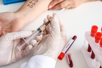 Young woman undergoing procedure of allergen skin tests in clinic