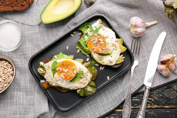 Tray with fresh tasty bruschettas on wooden background