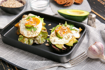 Tray with fresh tasty bruschettas on wooden background