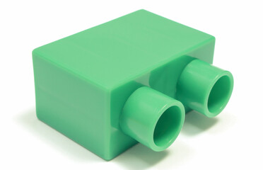 Green toy block for children on white background.