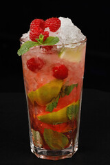 Mohito with fresh raspberries Isolated on a black background