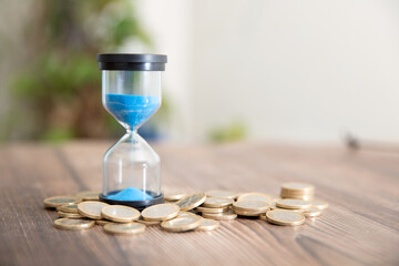 Hourglass timer and euro coin