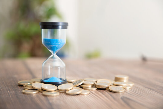 Hourglass timer and euro coin