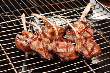 Rack of lamb cooked on the grill with the grill