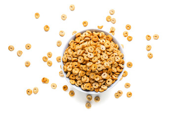Bowl with tasty cereal rings on white background