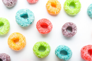 Fototapeta na wymiar Tasty cereal rings on white background, closeup